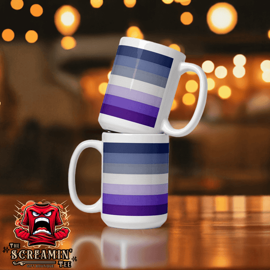 Butch Lesbian Pride Mug stacked with purple and blue stripes on a blurred background of warm lights.