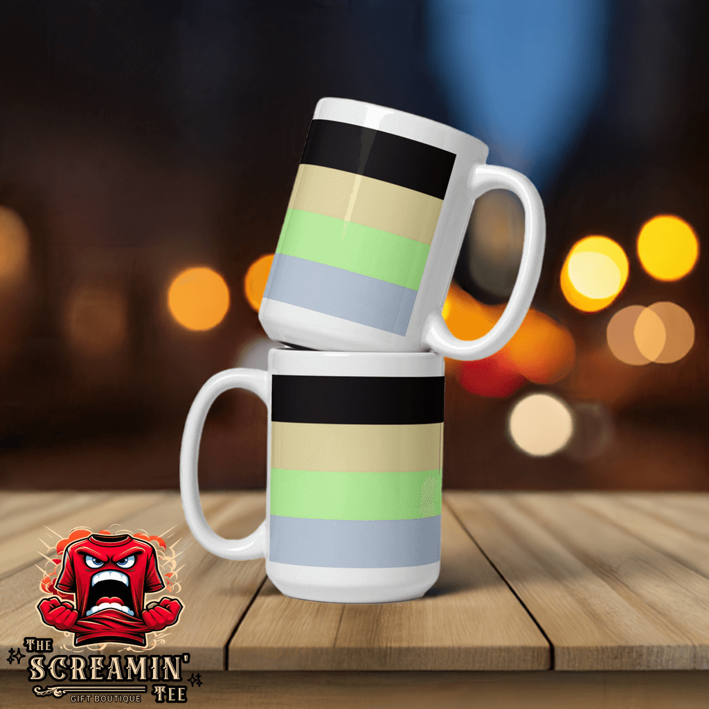 Cassgender Pride Mug stacked on a wooden table with blurred lights in the background.