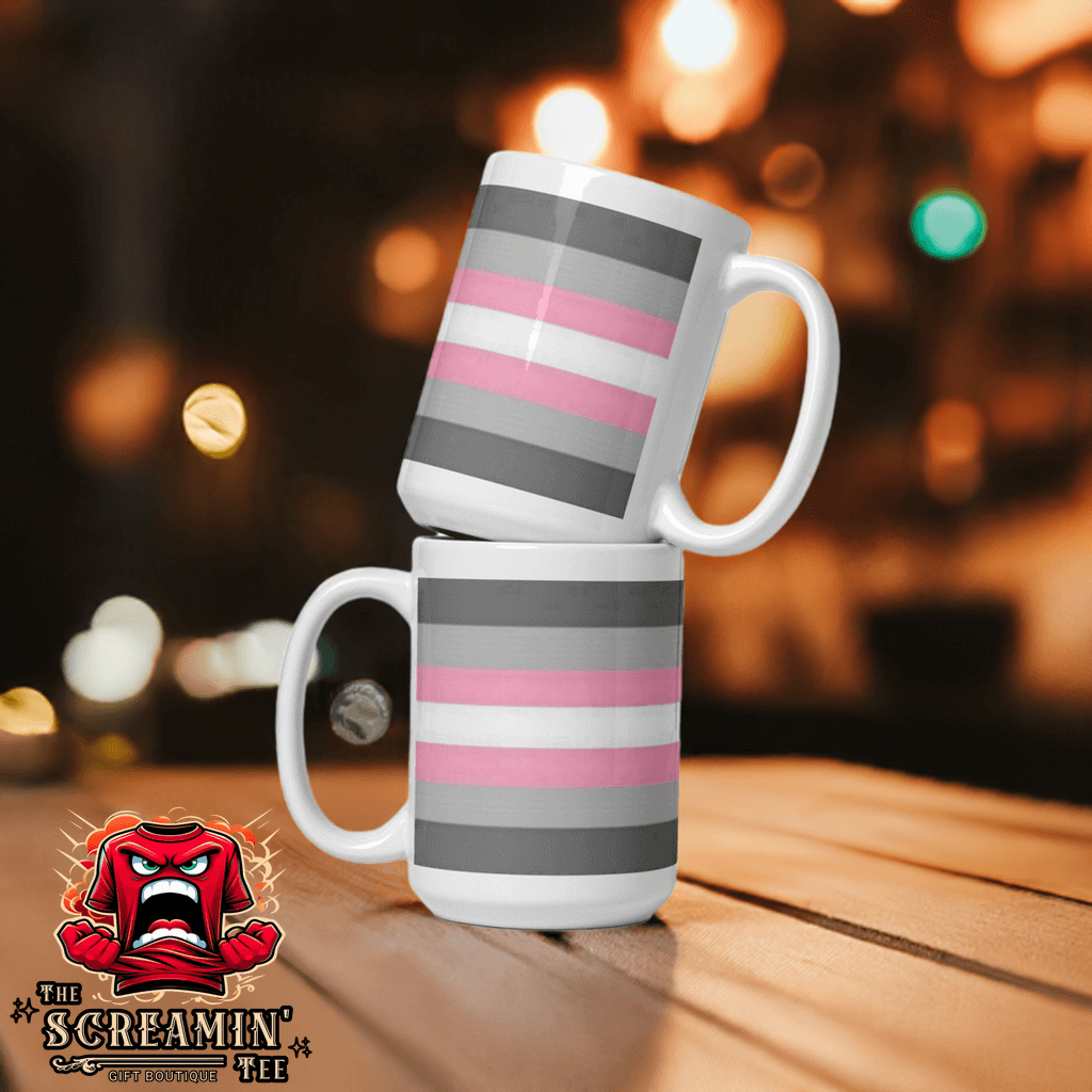 Two Demigender Demigirls Pride Mugs stacked with pink and gray stripes on a wooden table, perfect for any beverage.