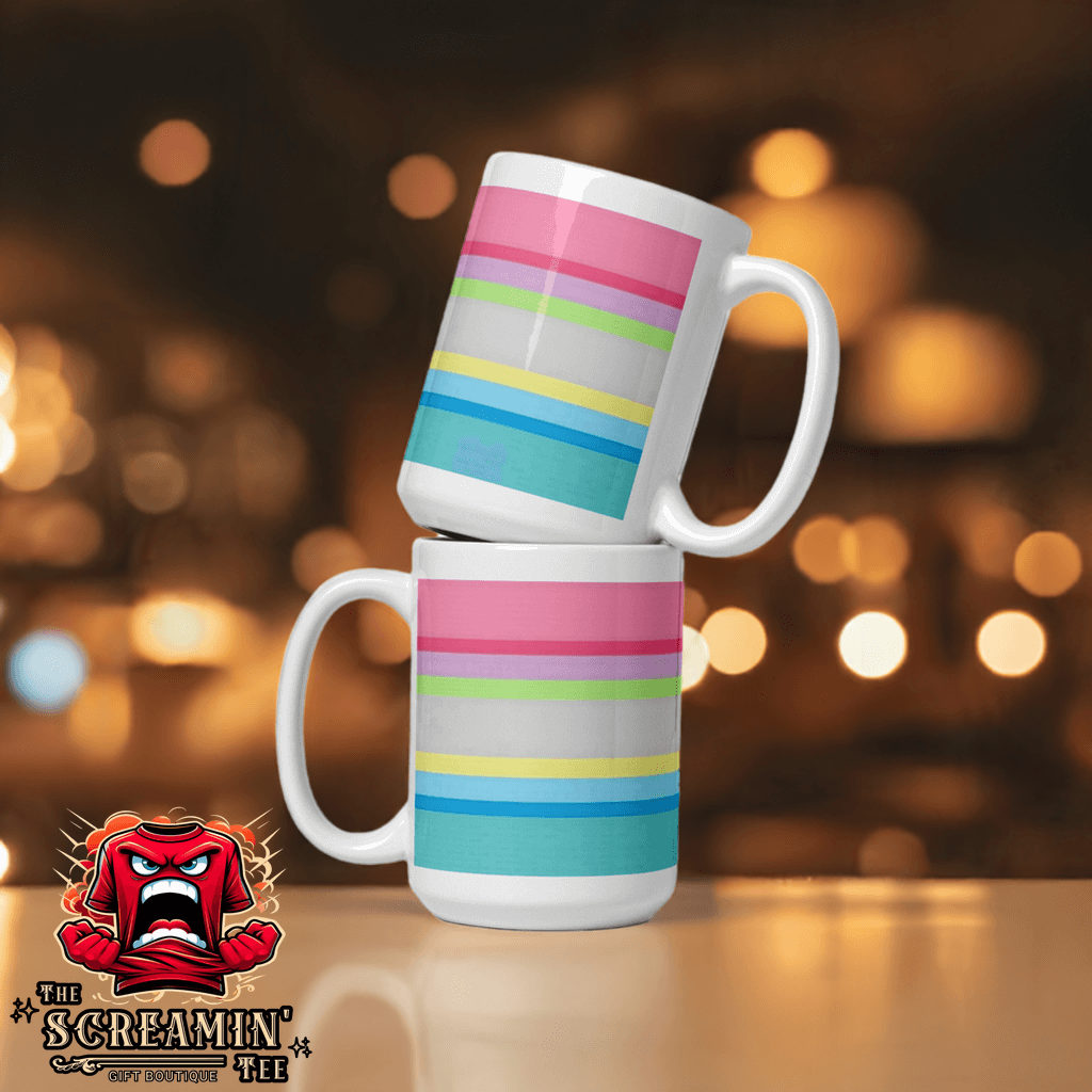 Gender Questioning Pride Mug featuring colorful stripes in pink, blue, and yellow, stacked on a table with blurred background.