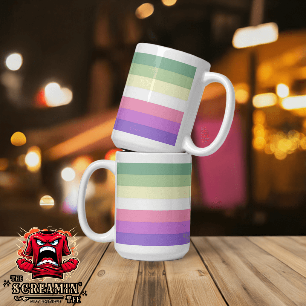 Genderfae Pride Mug with pastel stripes stacked on a table in a vibrant setting.