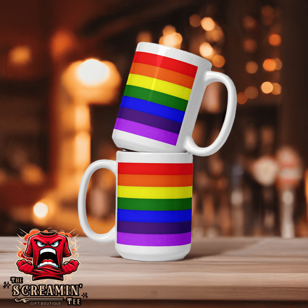 Gilbert Baker (Adapted Version) Pride Mug displayed in a cozy setting with rainbow design.