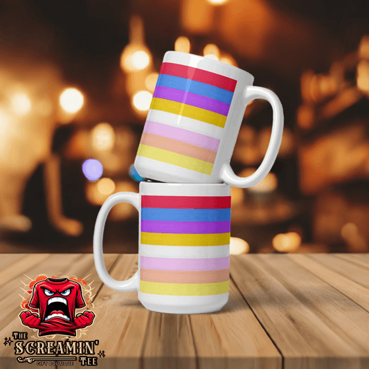 Pangender Pride Mug stacked on a wooden table with a vibrant striped design in a cozy setting.