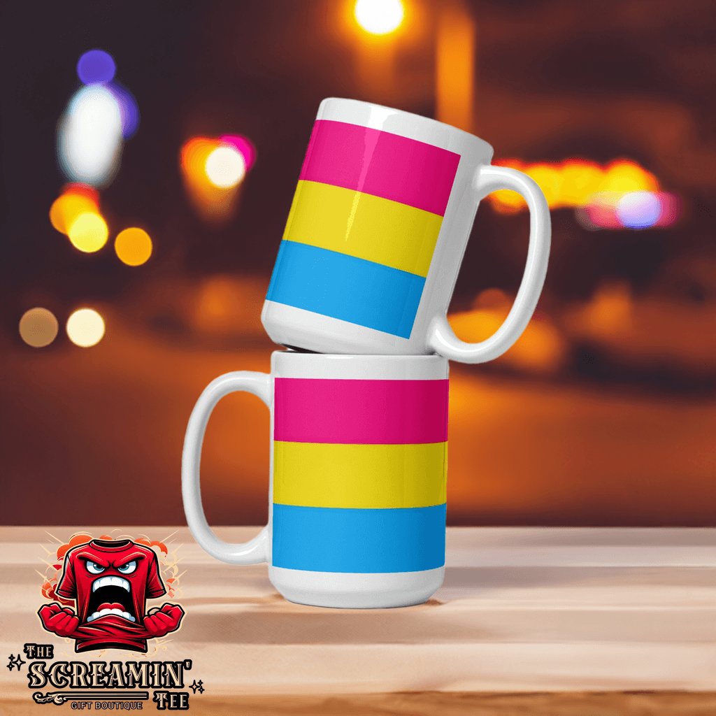 Two Pansexual Pride Mugs stacked, showcasing vibrant pink, yellow, and blue stripes against a blurred colorful background.