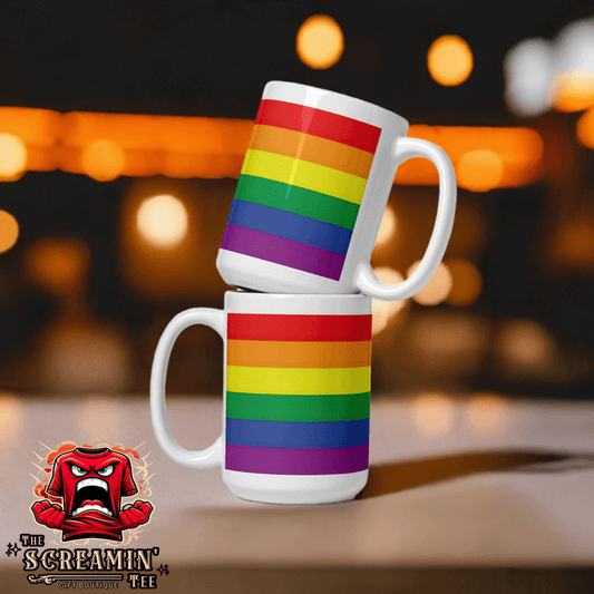 Traditional Pride Mug displayed in a stacked arrangement with a vibrant rainbow pattern against a blurred background.