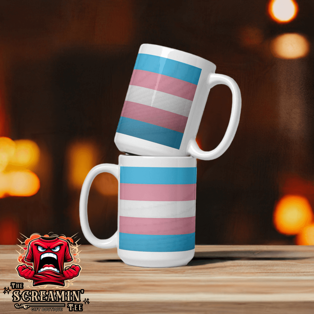Transgender Pride Mug featuring bold colors and glossy finish stacked against a blurred background.