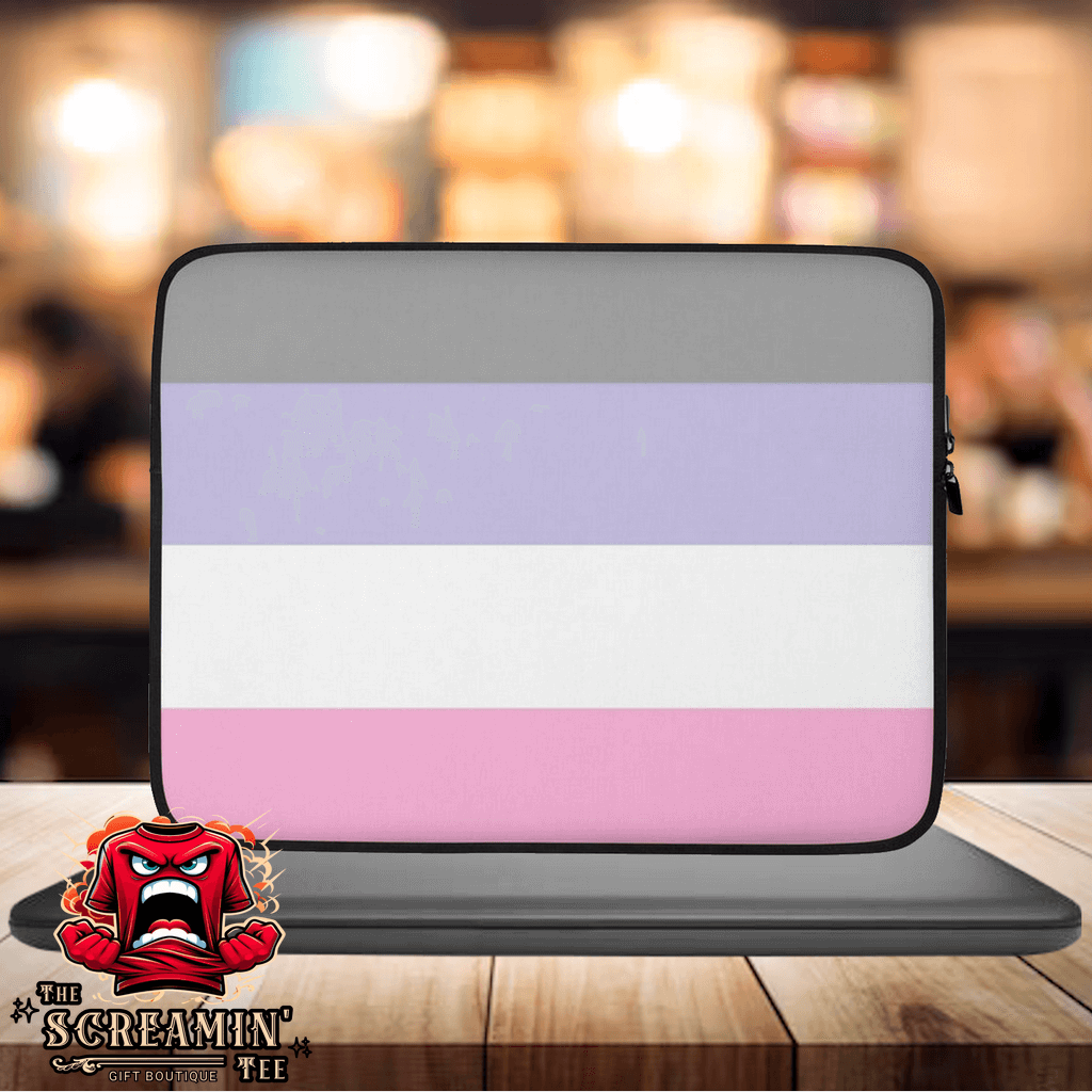 Cupiosexual Pride Laptop Sleeve on a wooden table, showcasing a stylish design with purple and pink stripes.