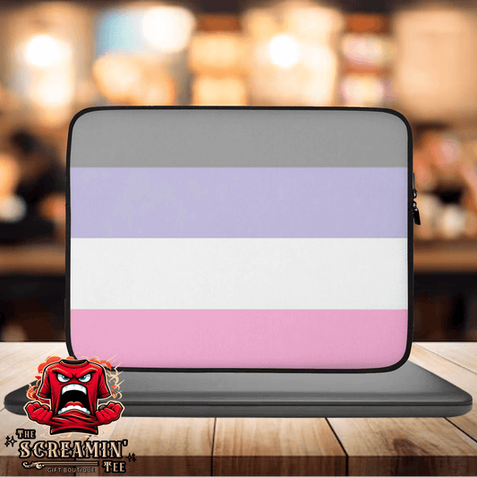 Cupiosexual Pride Laptop Sleeve on a wooden table, showcasing a stylish design with purple and pink stripes.