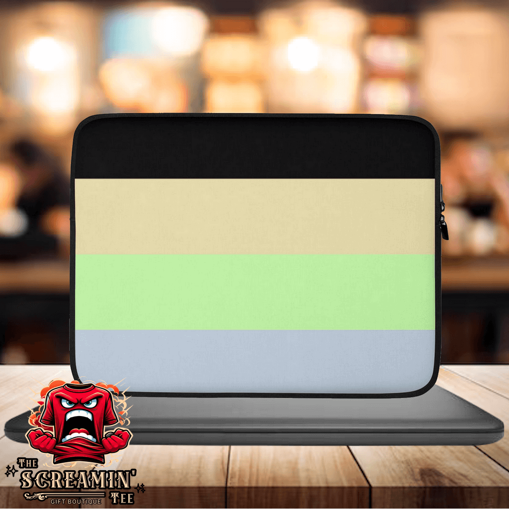 Cassgender Pride Laptop Sleeve displayed on a table with a blurred background, featuring soft pastel colors and a protective design.