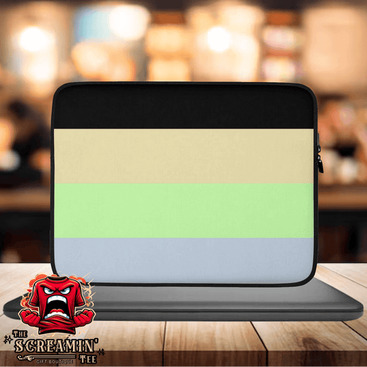 Cassgender Pride Laptop Sleeve displayed on a table with a blurred background, featuring soft pastel colors and a protective design.