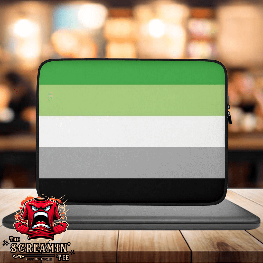 Aromantic Pride Laptop Sleeve with green, white, and gray stripes on a stylish desk setting.